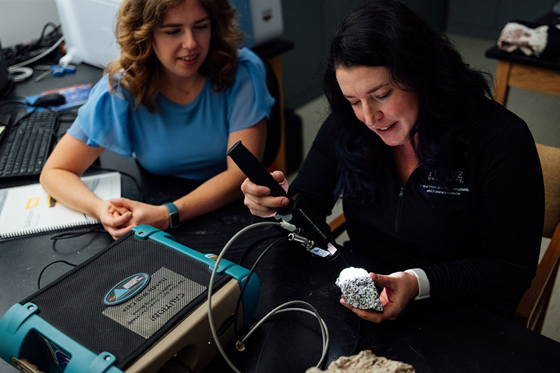 Dr. Briony Horgan working with spectroscopy equipment.